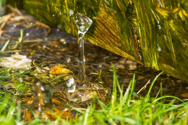 Water drops from a drainpipe